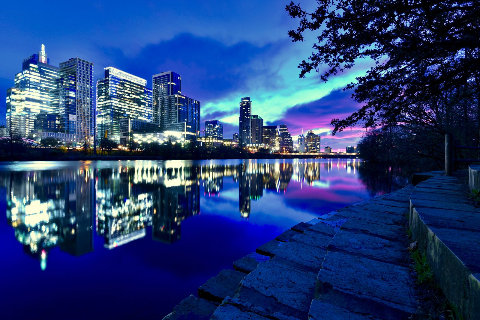 Downtown Austin skyline reflected in Lady Bird Lake before sunrise
